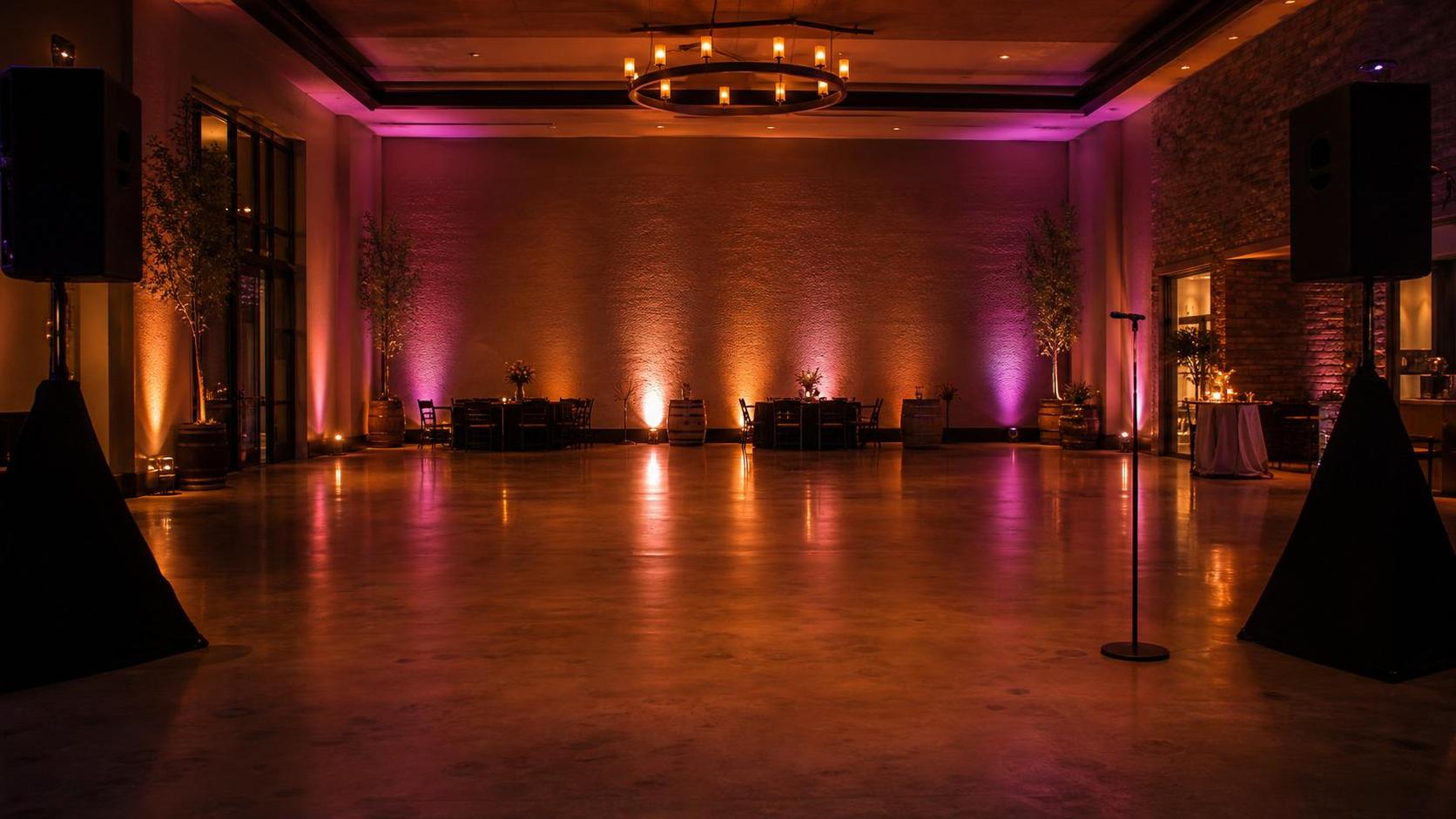 A rustic wedding venue set for an evening reception