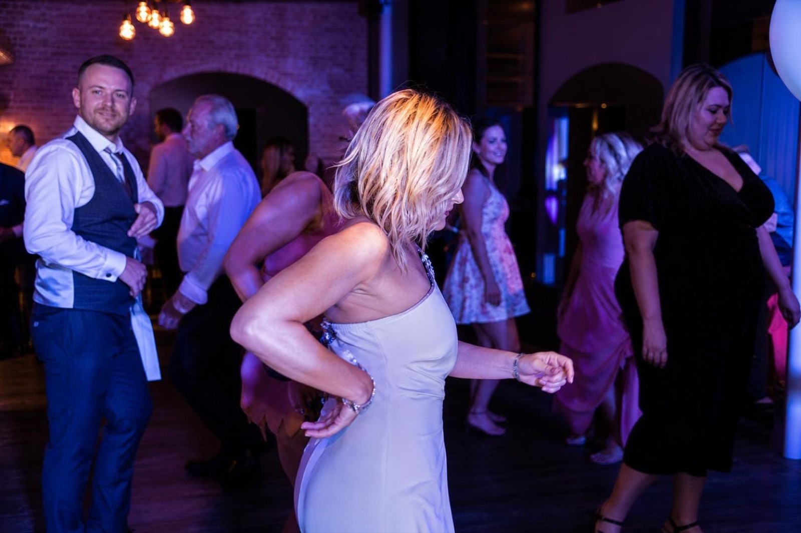 What It's Like to Watch a Couple's First Dance From the Booth