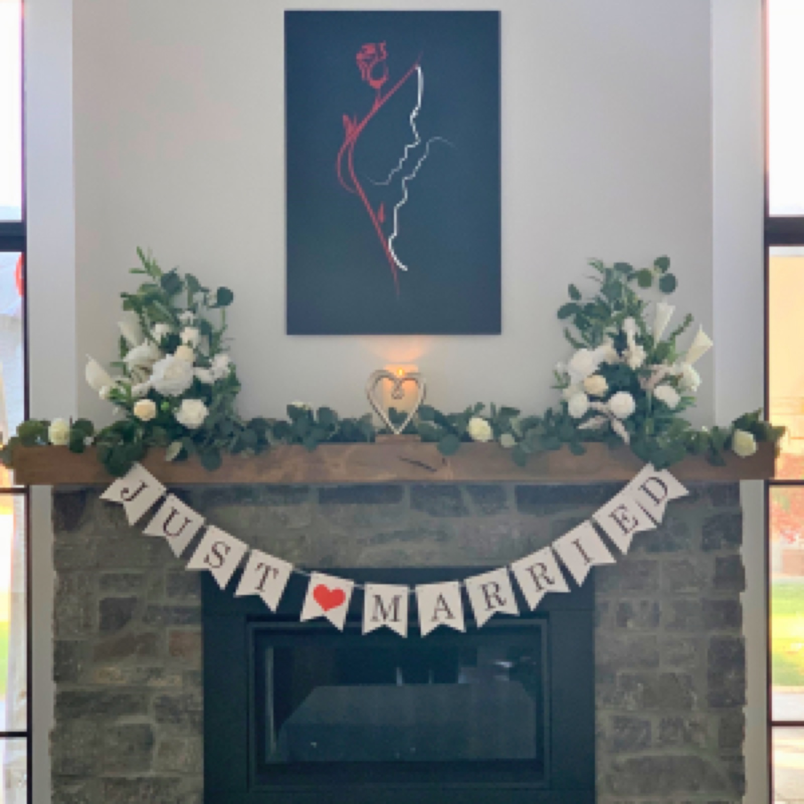 Newlywed couple celebrating by the fireplace at Belledor Vineyards in Plymouth, California