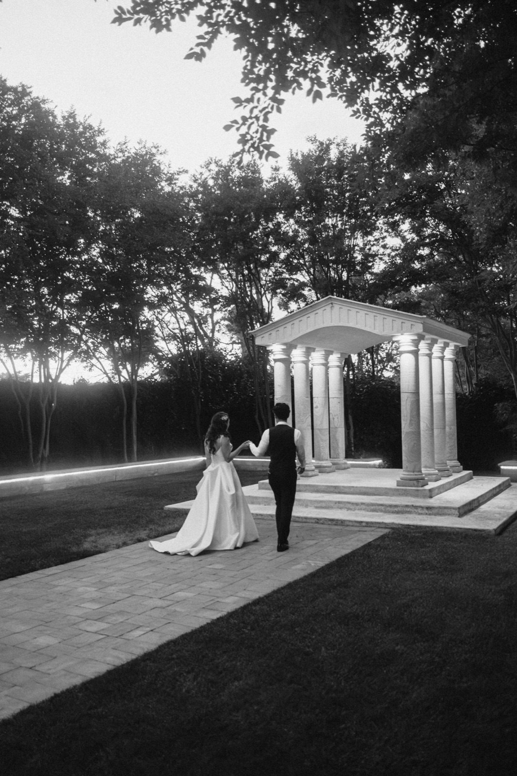 Evening reception and last dance under string lights at Brownstone Gardens in Oakley, California