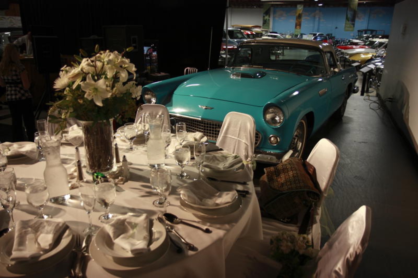 Wedding reception among classic cars at the California Automobile Museum in Sacramento