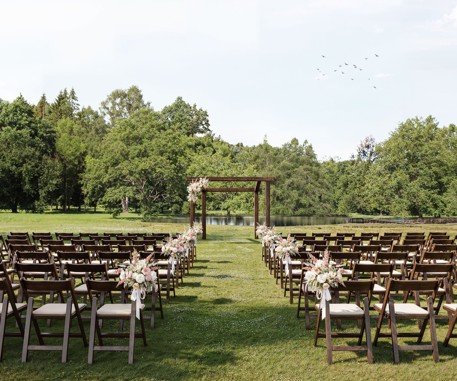 Outdoor pondside ceremony space at Casa del Rio by Wedgewood Weddings in Fresno, California
