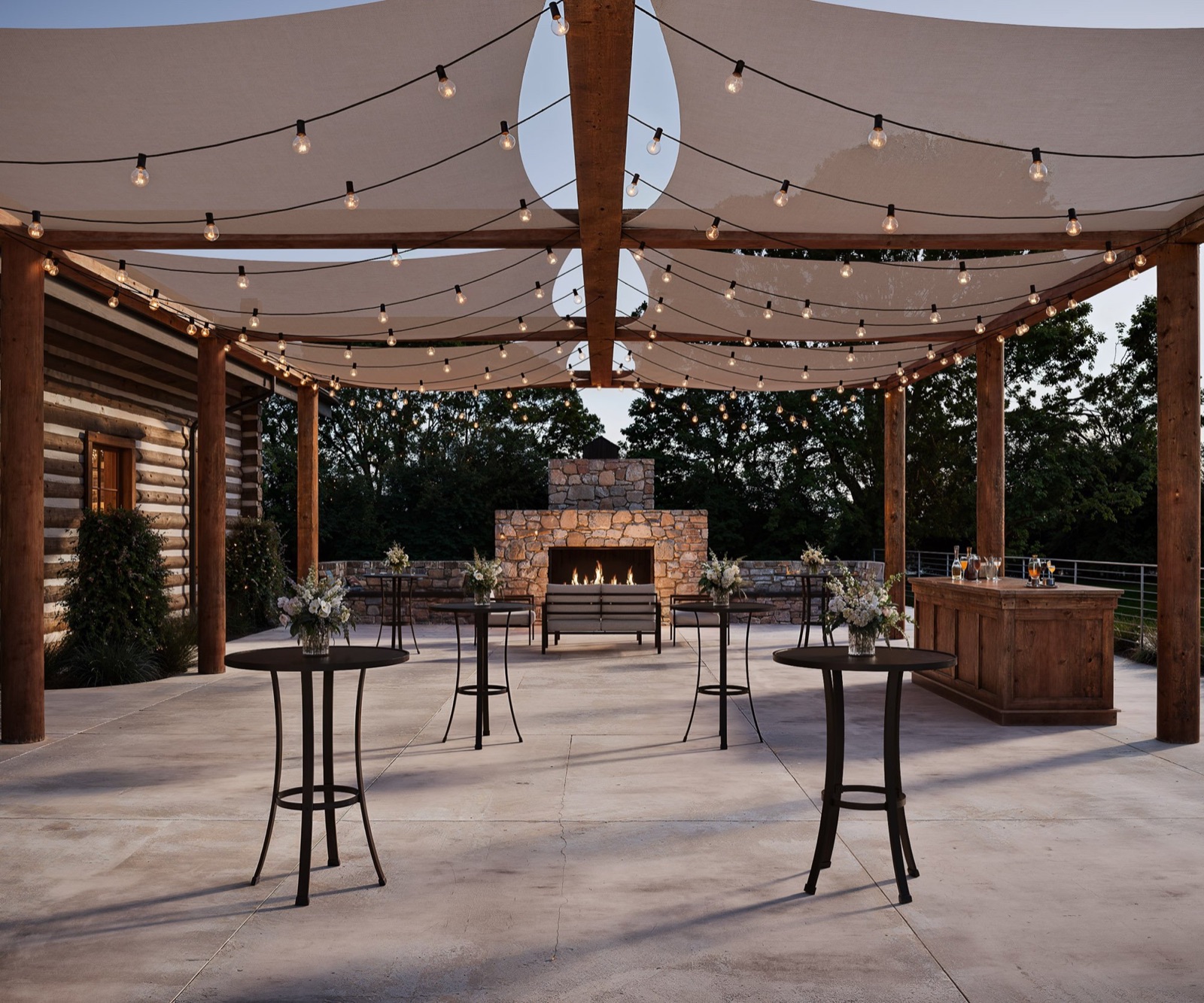 Outdoor cocktail patio with string lights at Casa del Rio by Wedgewood Weddings in Fresno, California