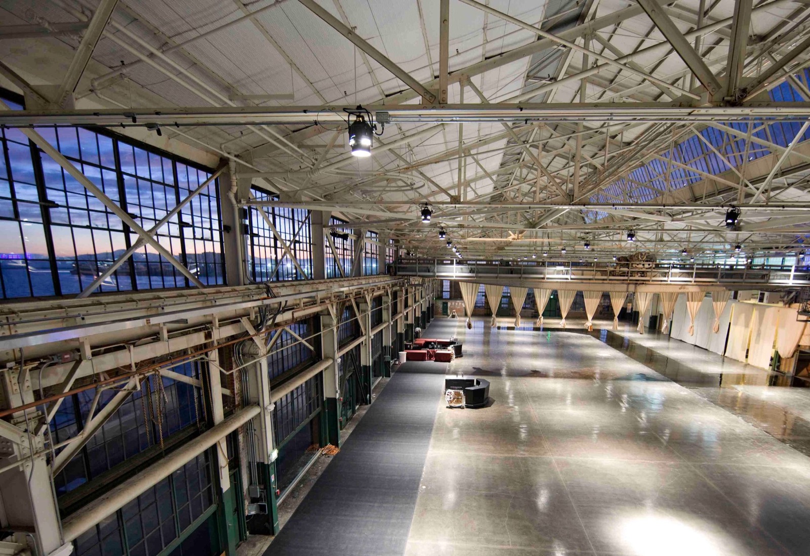Spacious reception hall with soaring ceilings at Craneway Pavilion, Richmond, California