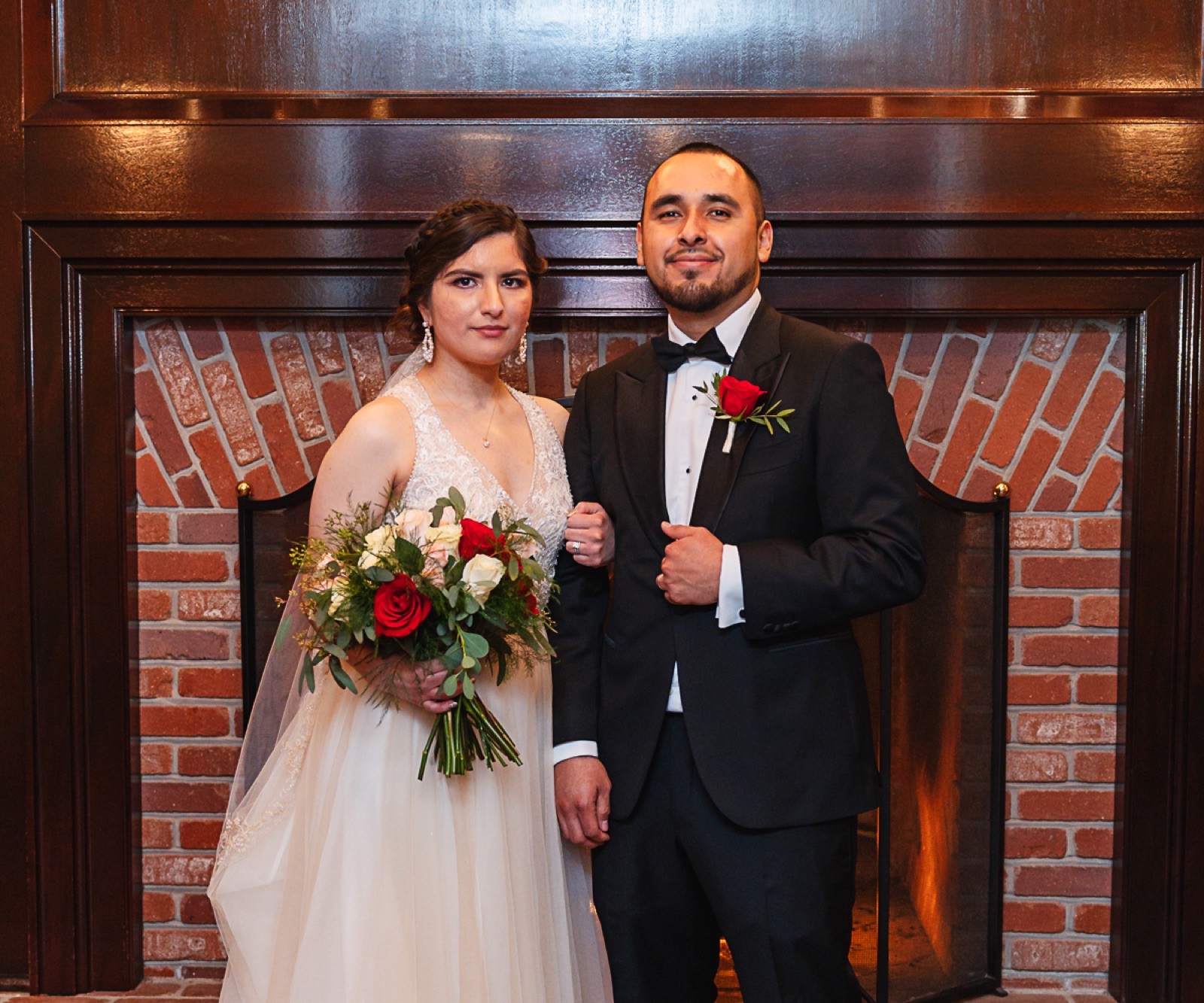 Couple beside the double-sided fireplace lounge at Eagle Ridge by Wedgewood Weddings in Gilroy, California