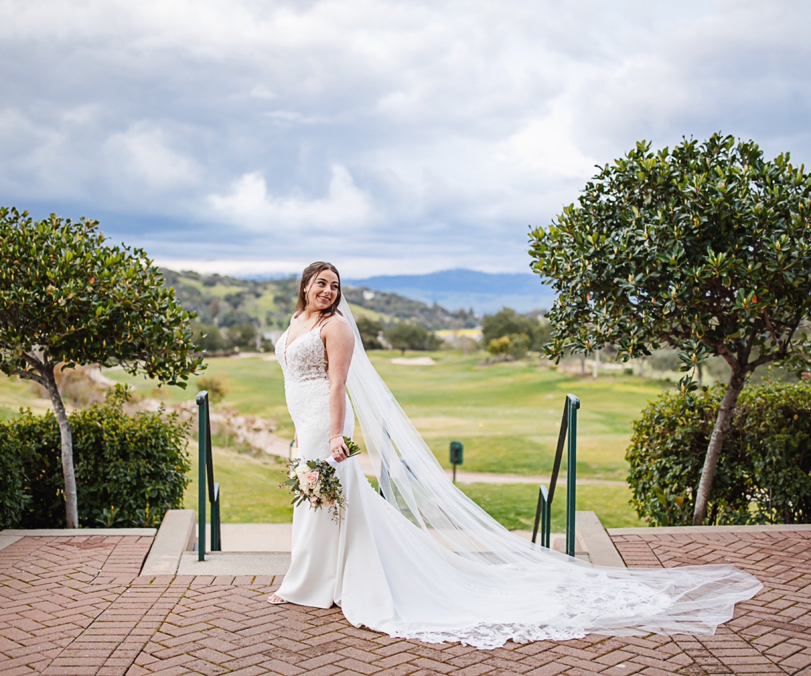 Bride with golf course and hillside views at Eagle Ridge by Wedgewood Weddings in Gilroy, California
