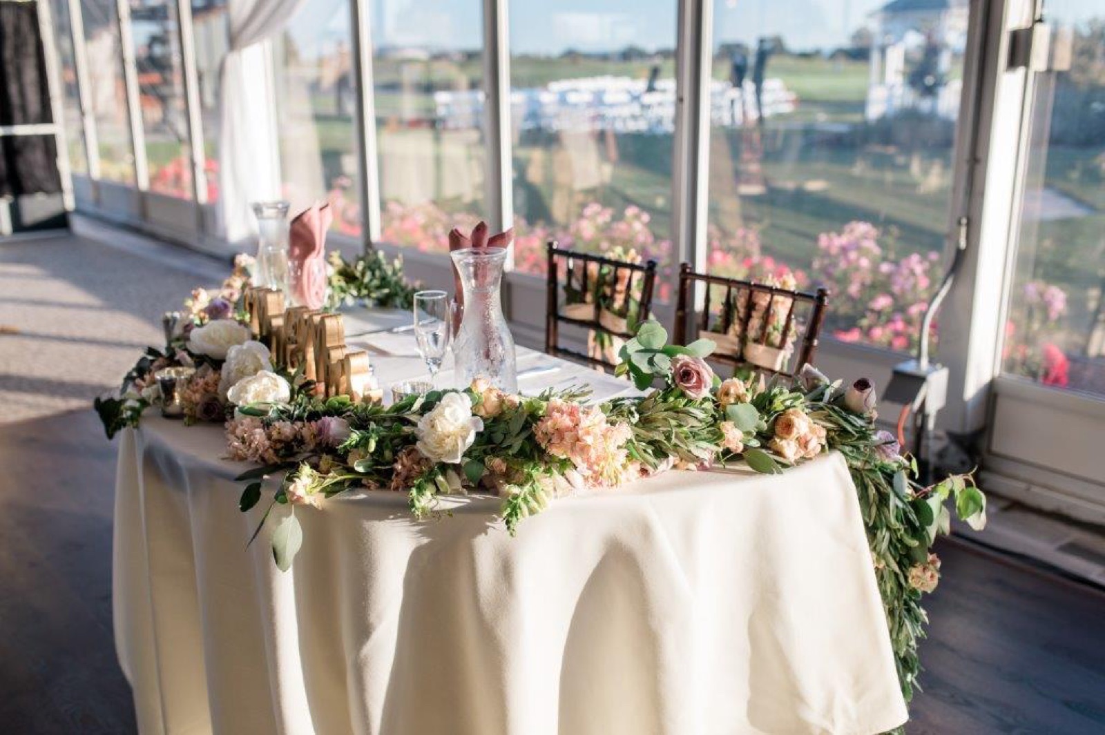 Decorated sweetheart table at a reception at Fairview Metropolitan in Oakland, California