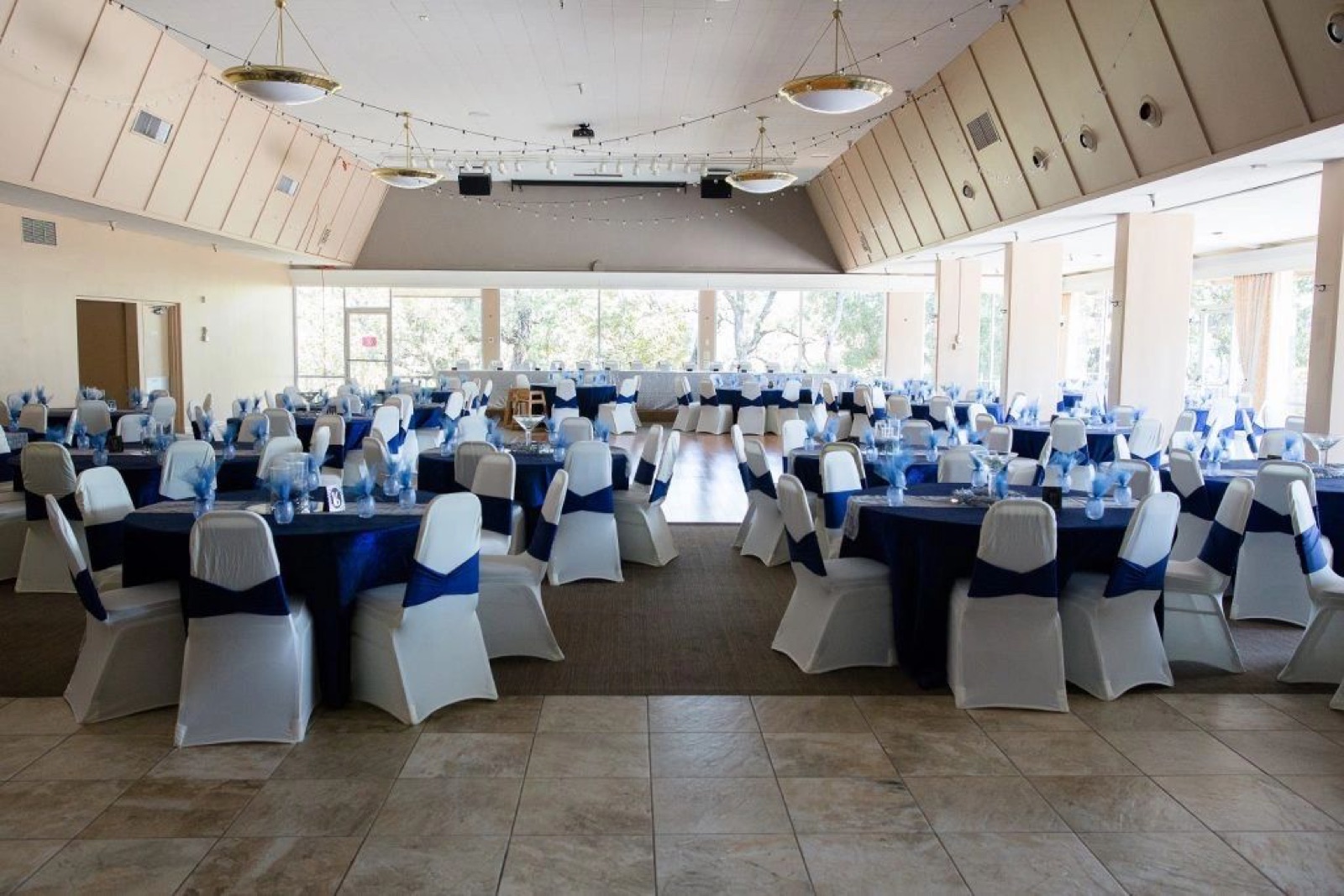 Reception hall set for an event at Gilroy Lodge on the Hill wedding venue in Gilroy, California