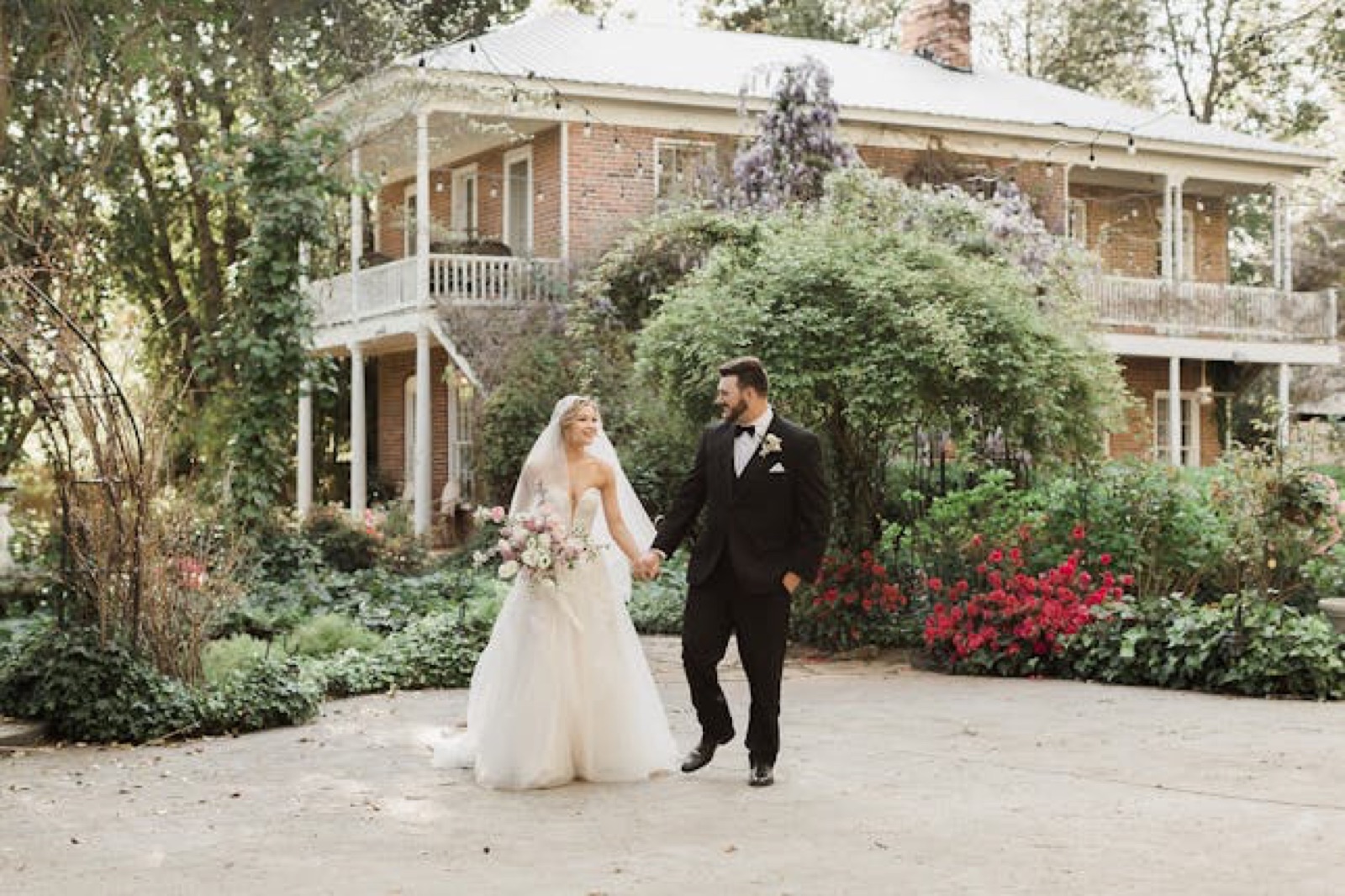 Lush flowering gardens and pathways at the Heirloom Inn wedding venue in Ione, California