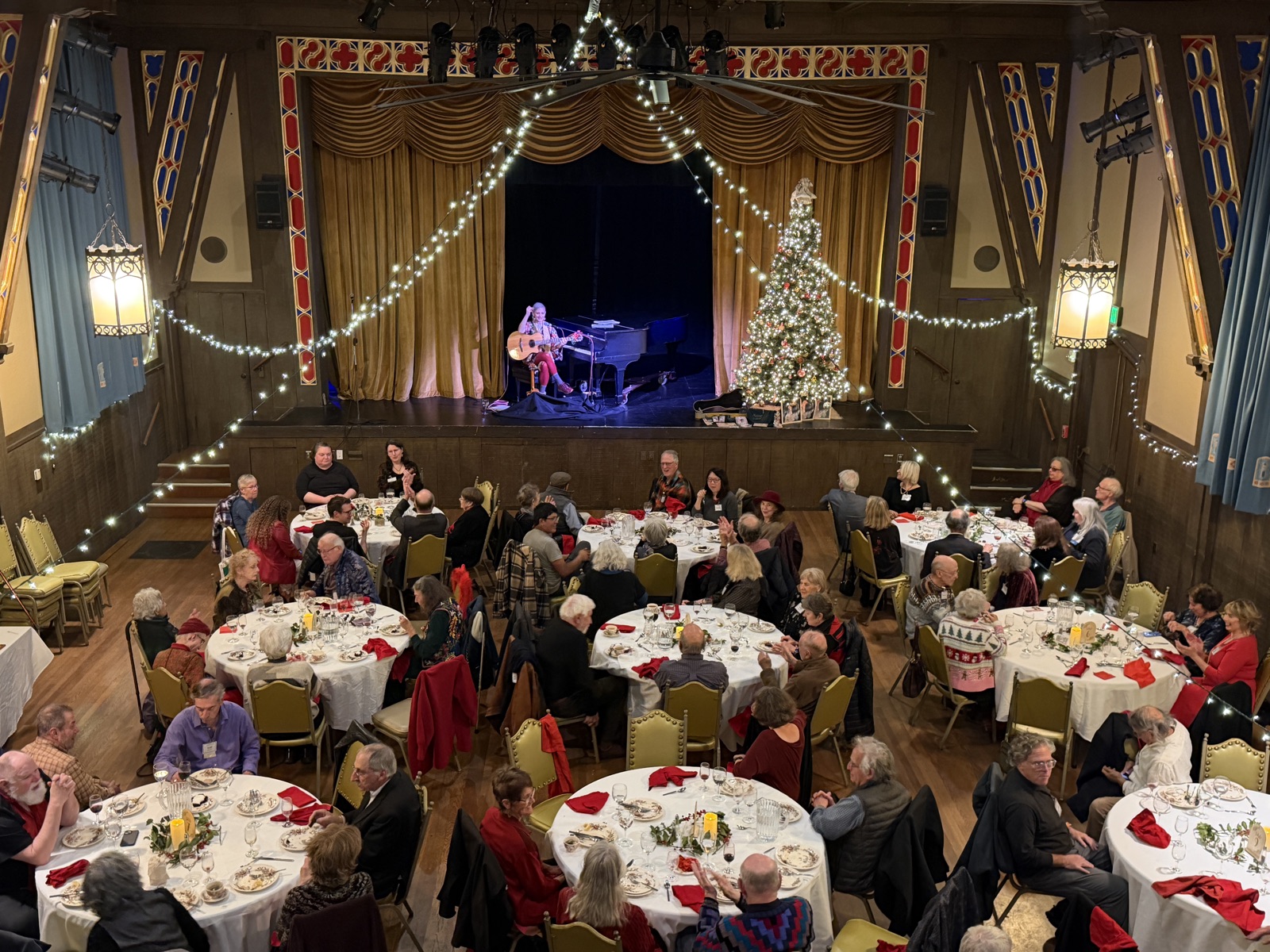 Seated dinner reception setup inside the Hillside Club event hall in Berkeley, California