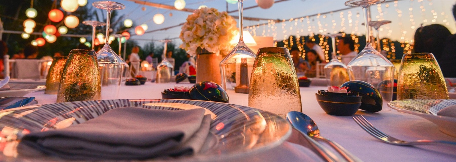 Elegant dining setup with lanterns for a reception at Hotel Los Gatos in Los Gatos, California