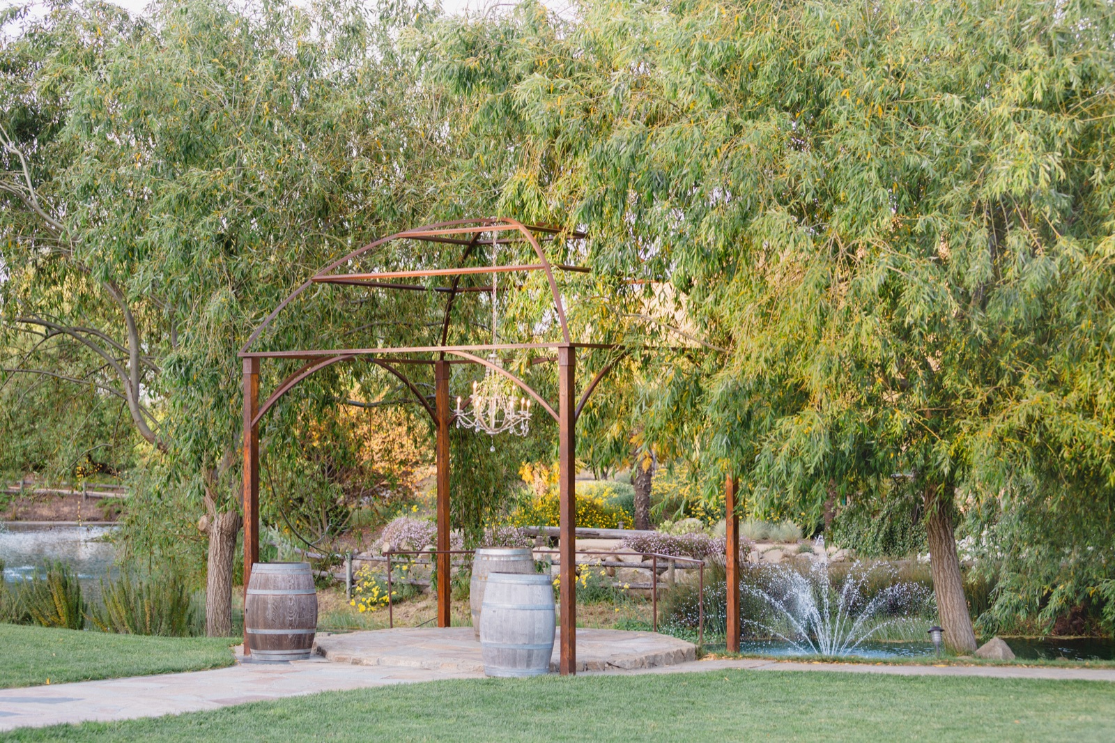 Garden ceremony setting with waterfall at Nella Terra Cellars in Sunol, California