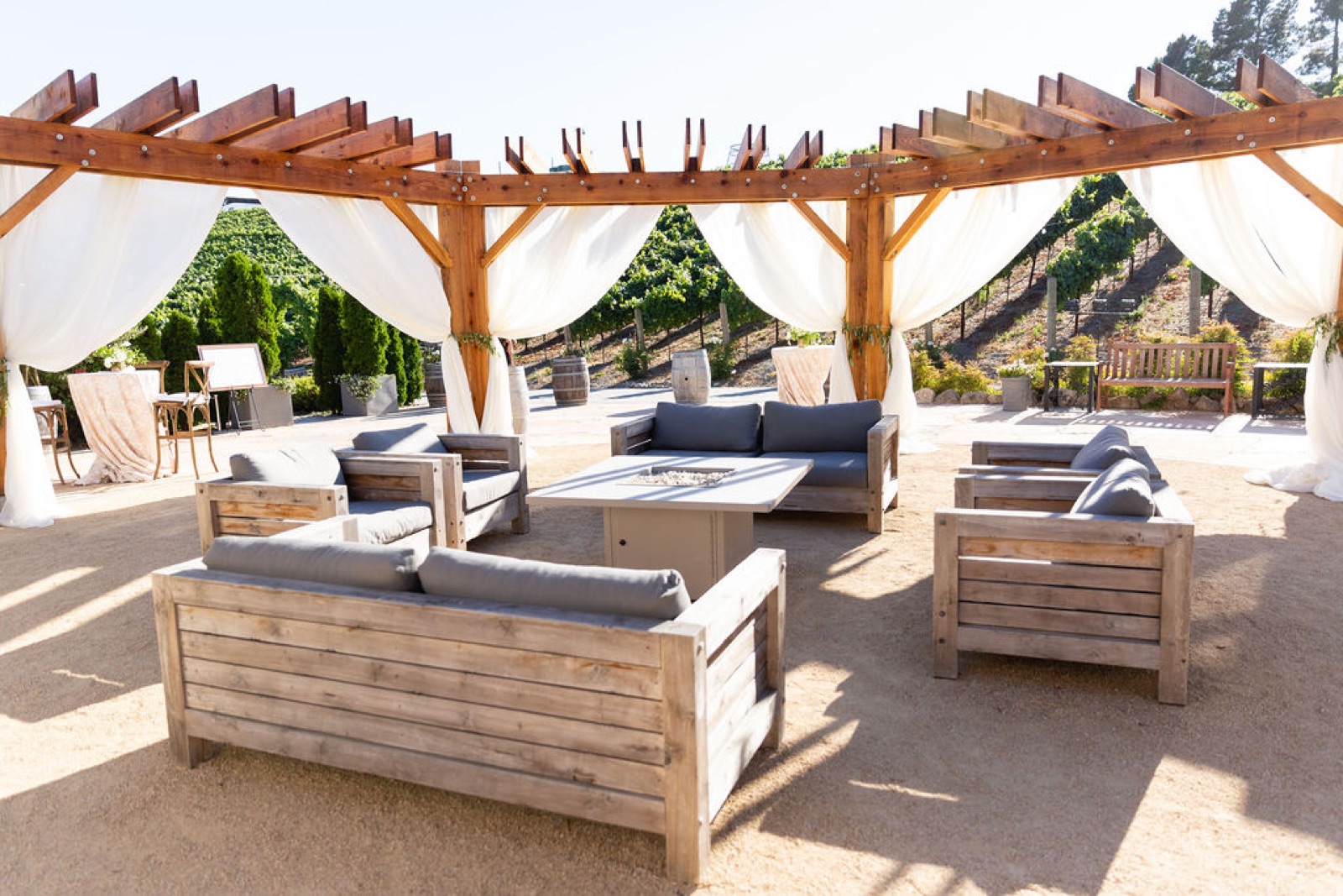 Flagstone patio cocktail and reception area at Nella Terra Cellars wedding venue in Sunol, California