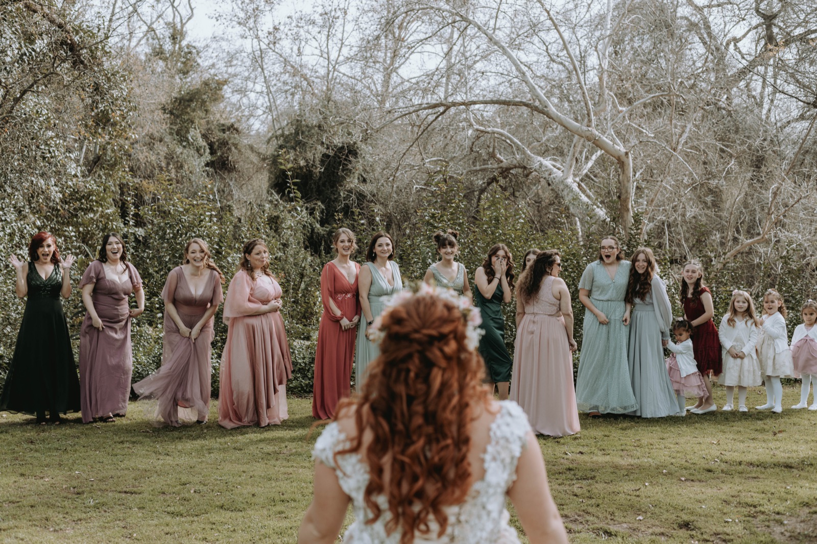 Outdoor ceremony lawn under oak trees at River Bottom Ranch in Sanger, California
