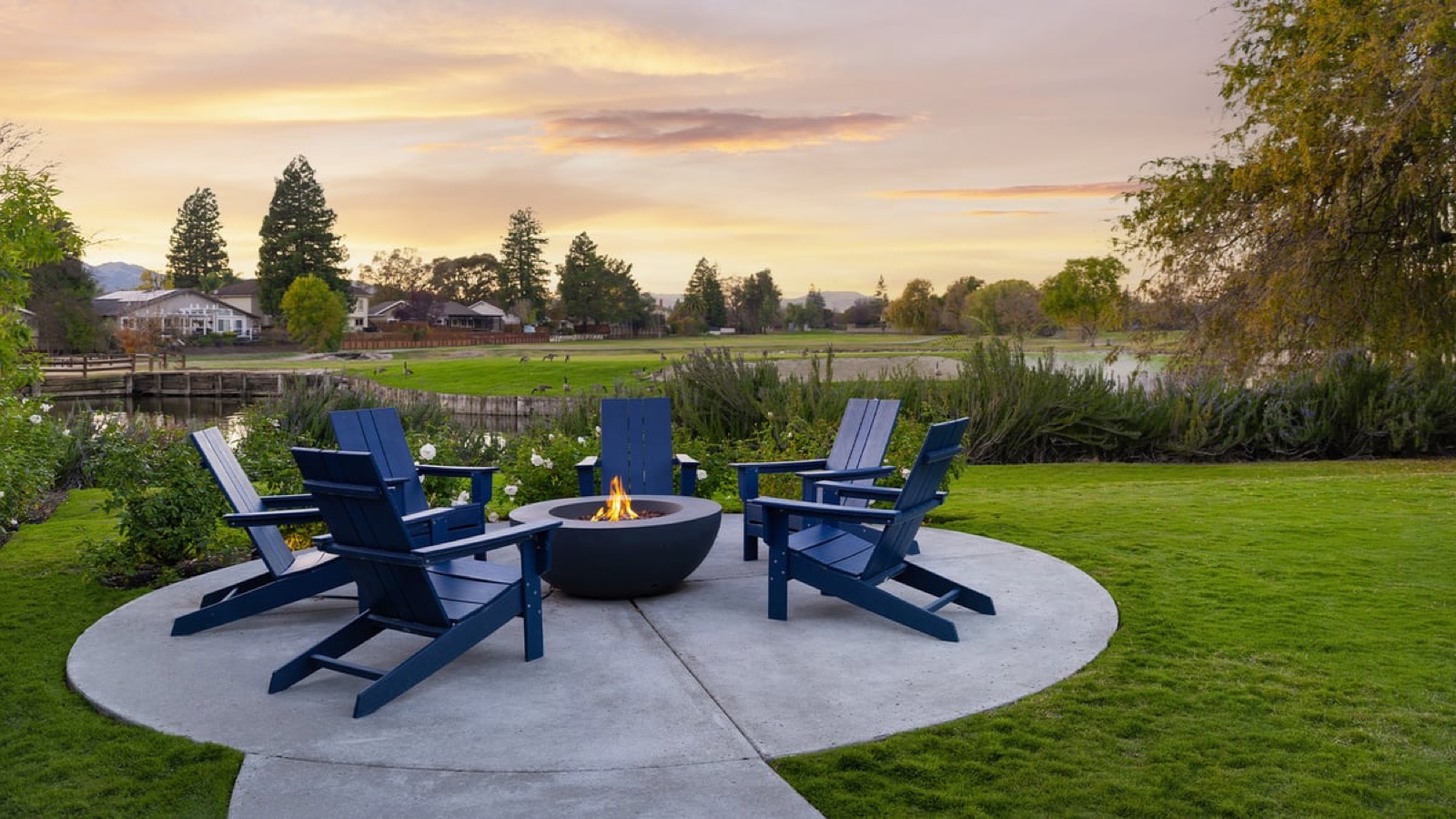 Lakeside fire pit and lounge area with weeping willows at San Ramon Golf Club wedding venue in San Ramon, California