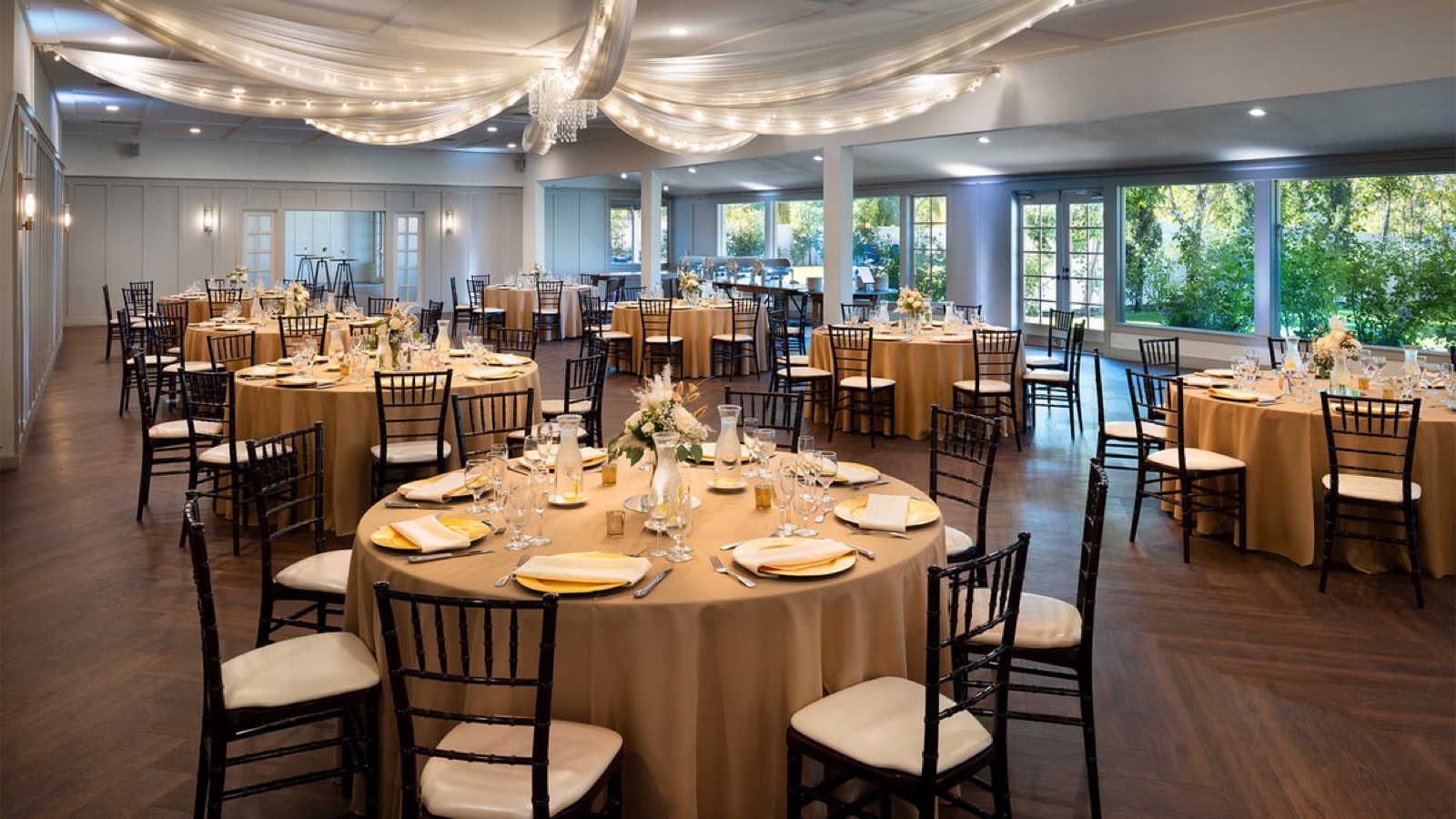 Wedding reception ballroom with champagne linens and crystal-accented ceiling at San Ramon Golf Club, San Ramon, California