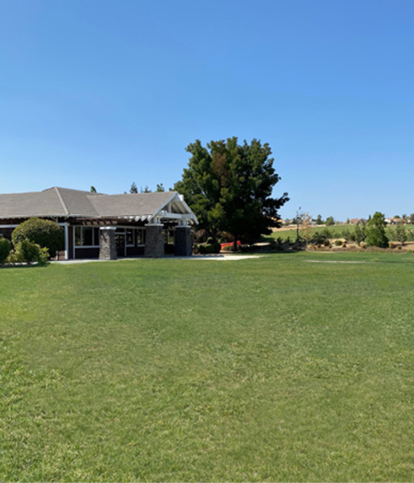 Outdoor event lawn with golf course views at Shadow Lakes Club in Brentwood, California