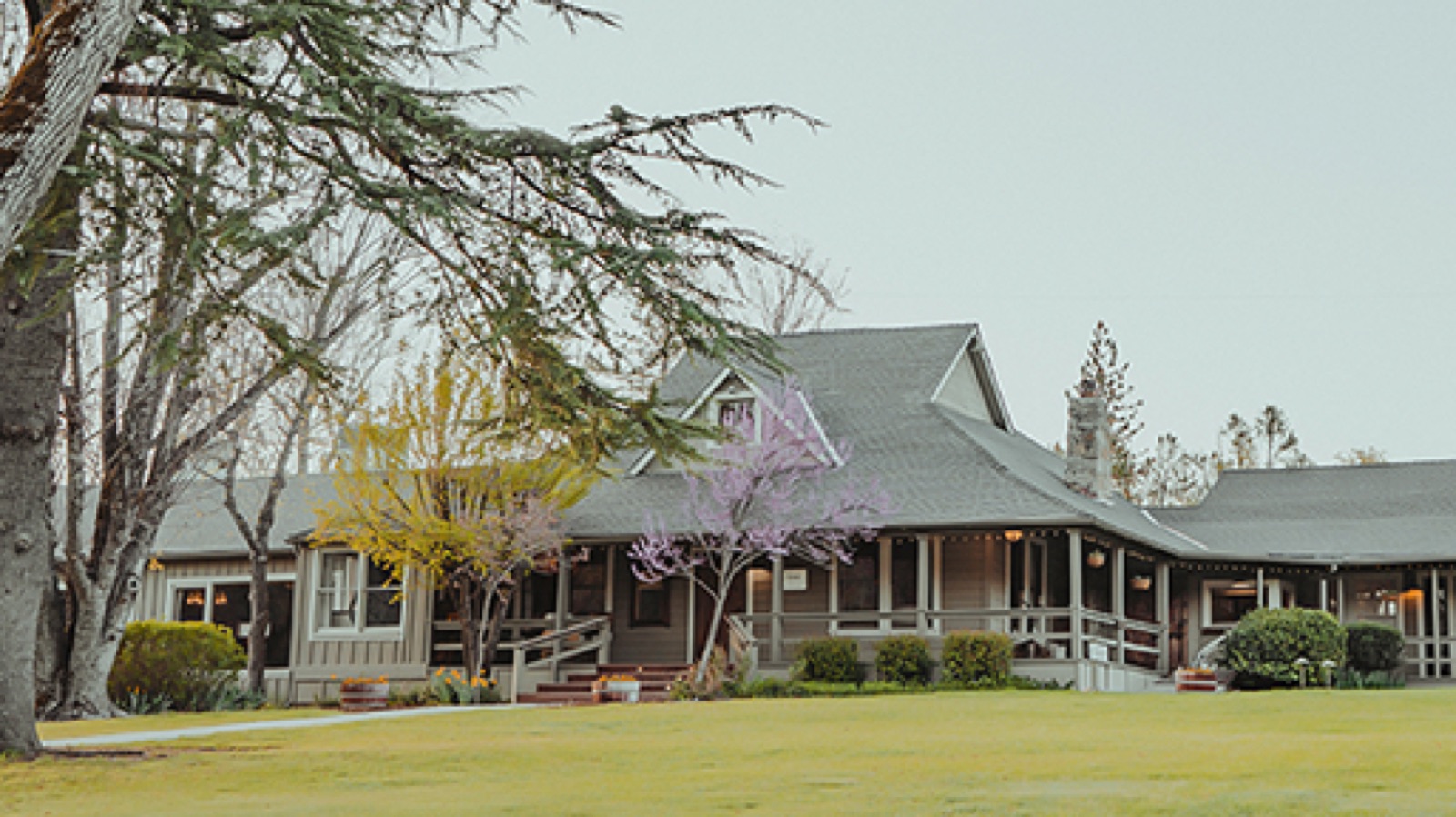 Yosemite Lawn outdoor ceremony space surrounded by gardens at Sierra Sky Ranch in Oakhurst, California