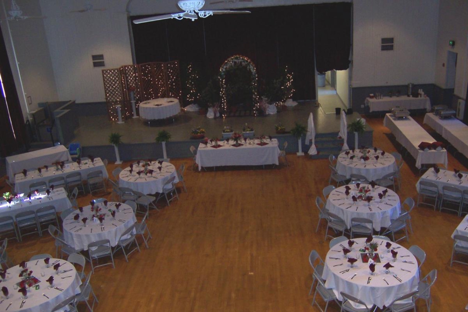 Decorated event space with stage and draperies at Sonora Opera Hall in Sonora, California