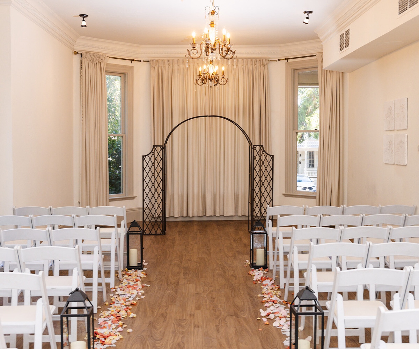 Indoor ceremony space with draping and chandeliers at Sterling Hotel by Wedgewood Weddings, Sacramento