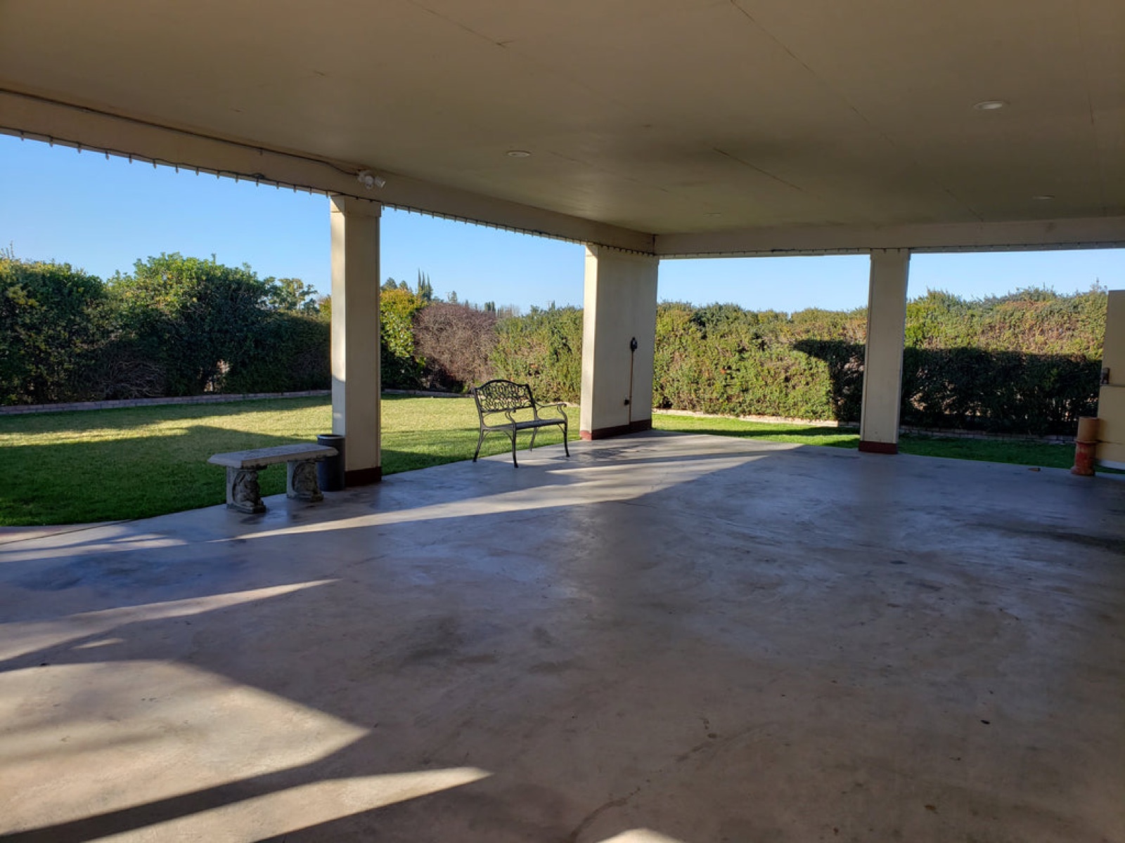 Outdoor patio and lawn area at the Sylvan Improvement Club wedding venue in Modesto, California