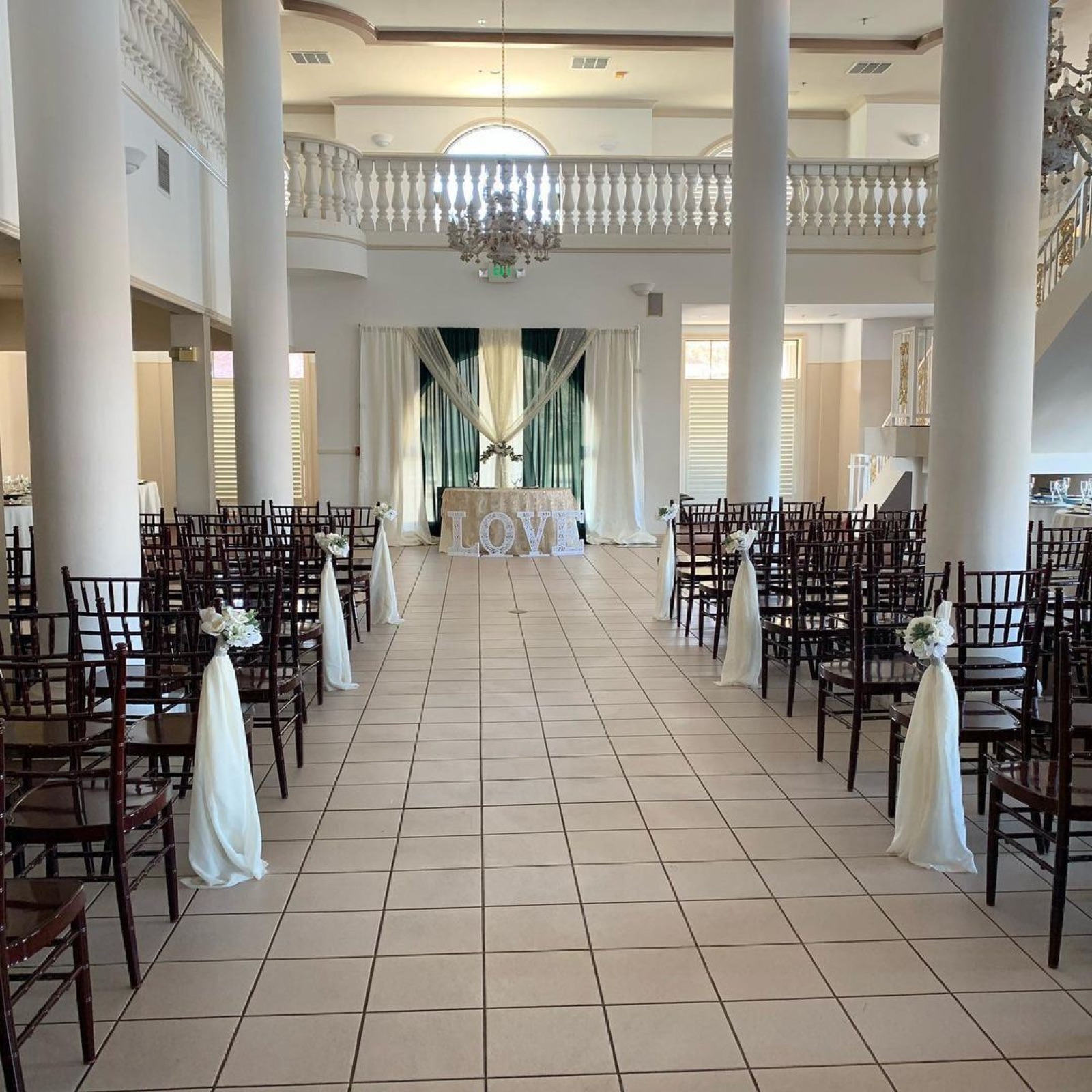 Ballroom and chandeliers at The Almond Pavilion wedding venue in Oakdale, California
