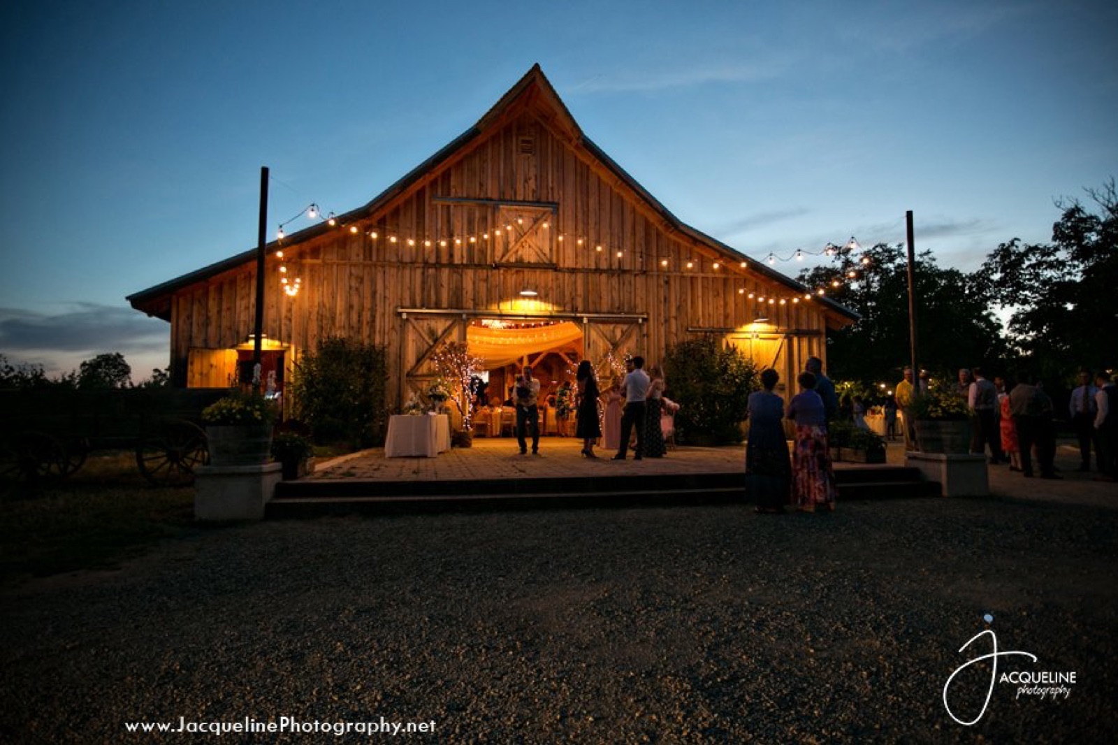 Illuminated barn at night at The Barn at Amador Cellars wedding venue in Plymouth, California