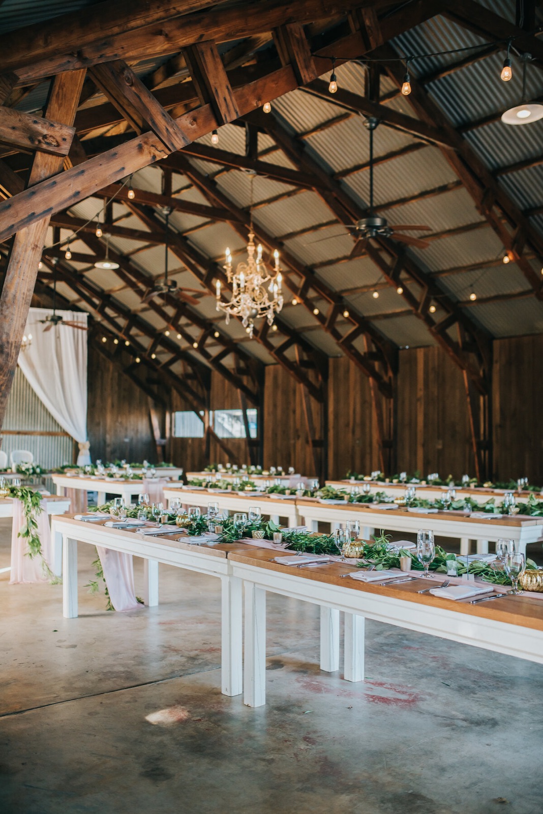 Grassy ceremony grounds and oak trees at The Barn at Second Wind in Sacramento, California