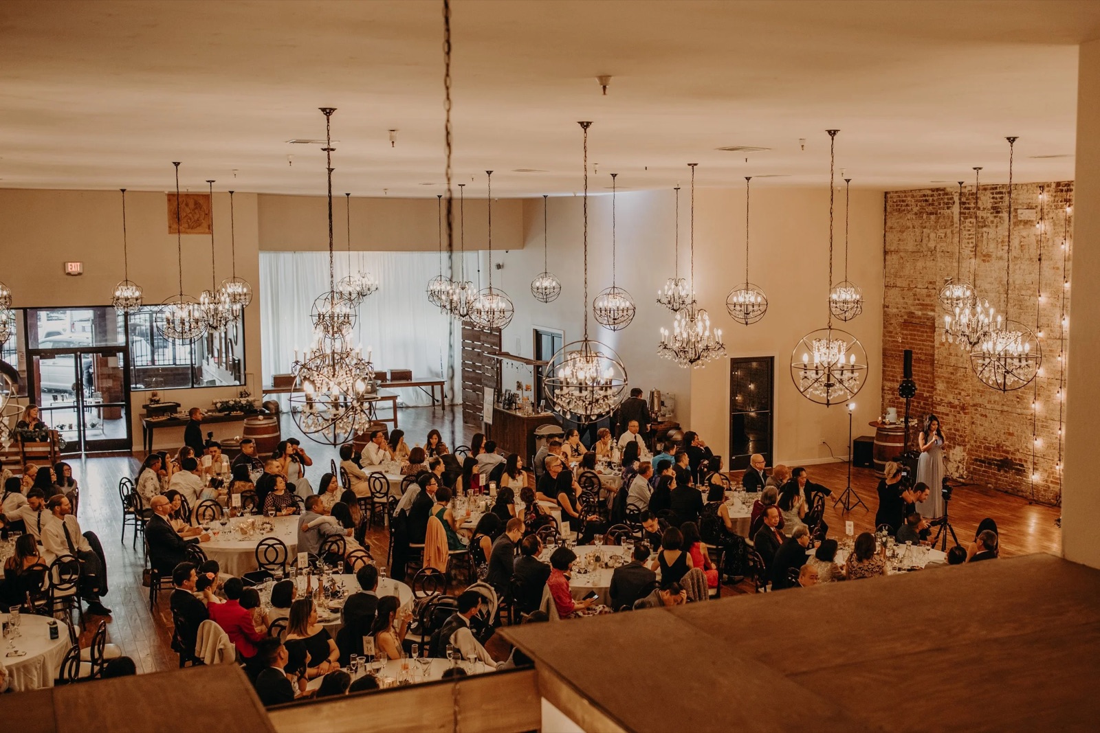 Wedding reception under chandeliers at The Century in Modesto, California