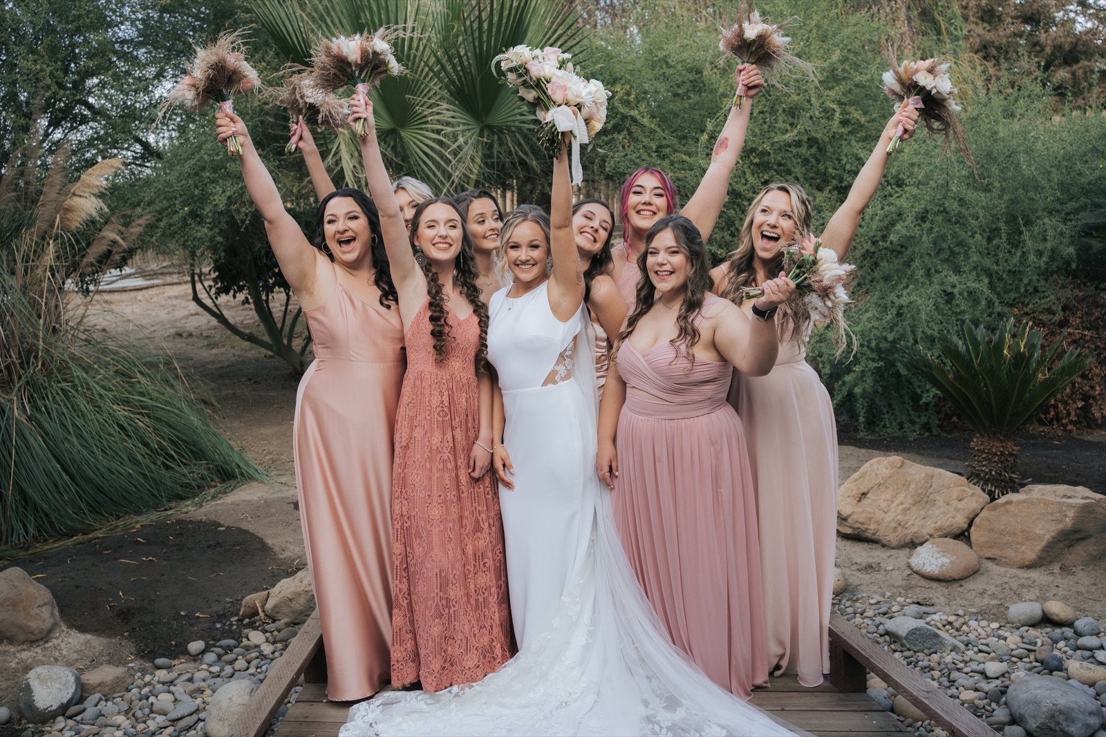 Wedding party celebrating on the lawn at The Sunset Acres in Fowler, California